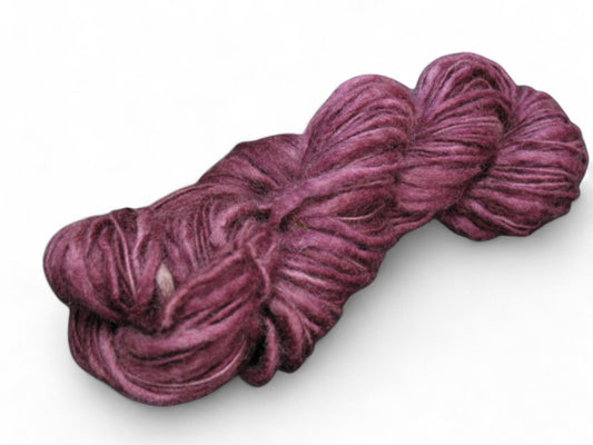 Rich burgundy hand-dyed merino wool yarn, worsted weight, one ply, perfect for knitting and crochet enthusiasts.