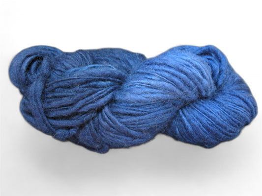 Medieval Blue merino wool yarn in worsted weight, hand-dyed with a soft and thick texture, ideal for crochet and knitting projects